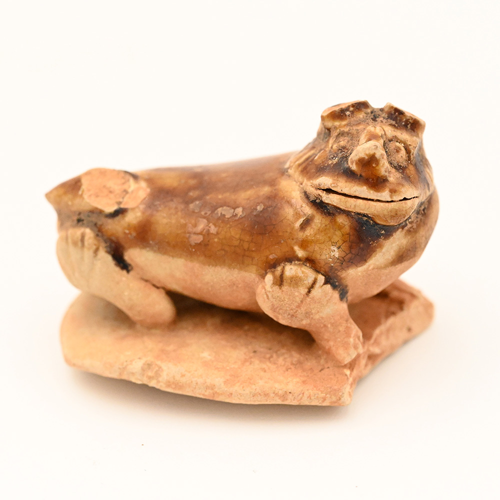 miniature ceramic figure of a lion dog