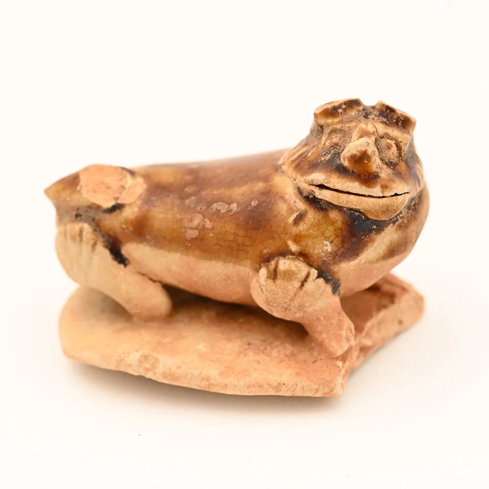 miniature ceramic figure of a lion dog