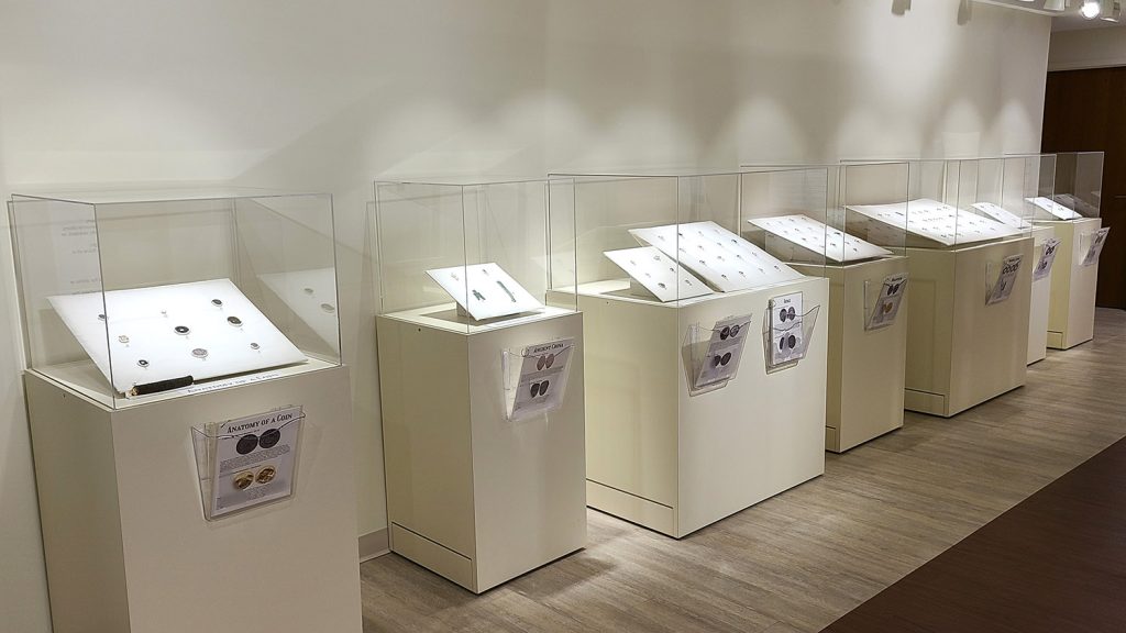 exhibit cases with coins in them