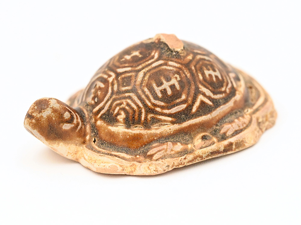 miniature ceramic figure of a freshwater turtle