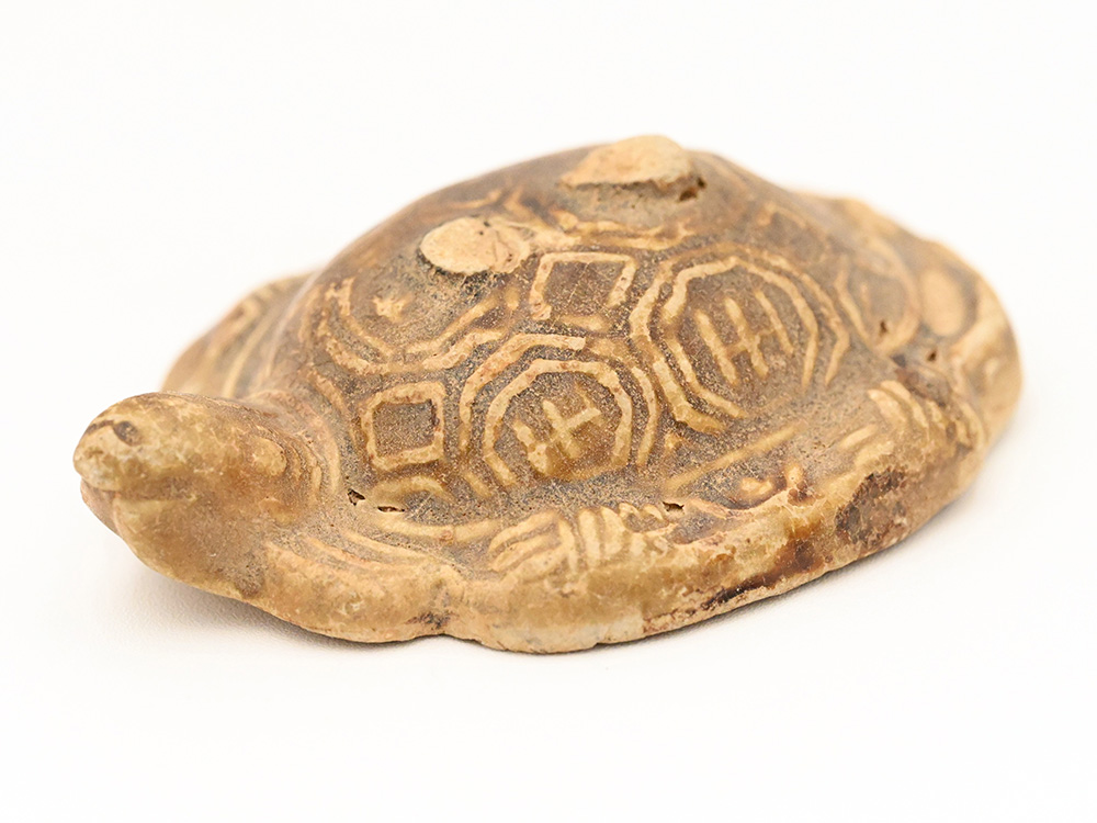 miniature ceramic figure of a freshwater turtle