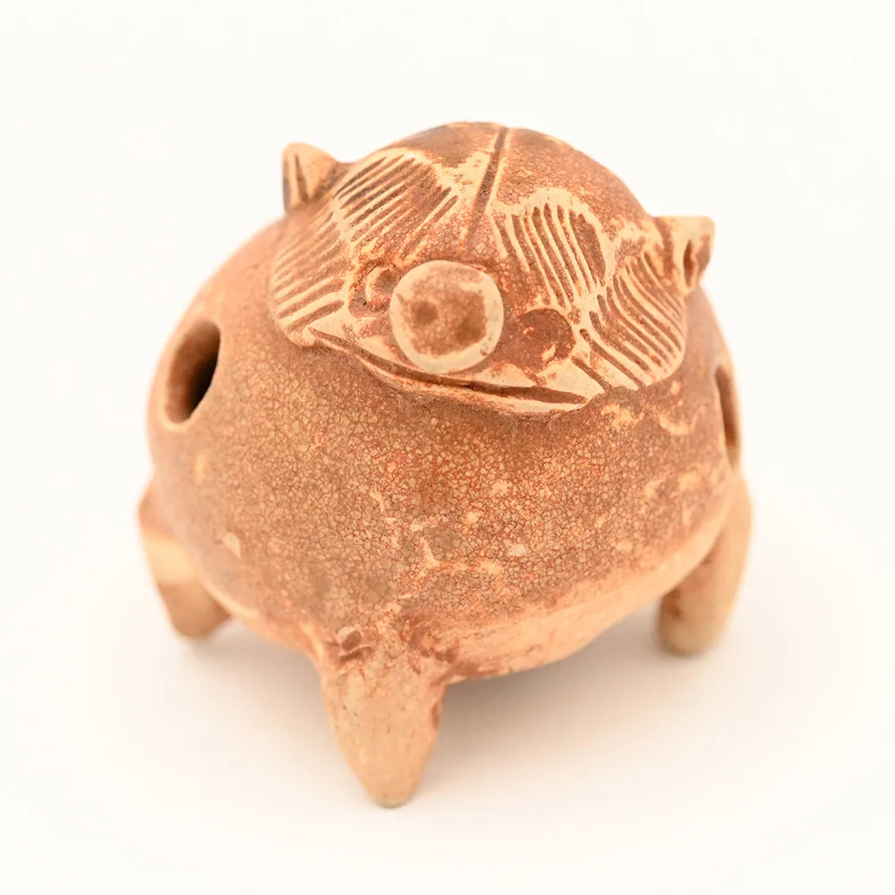 ceramic whistle in the shape of a pig