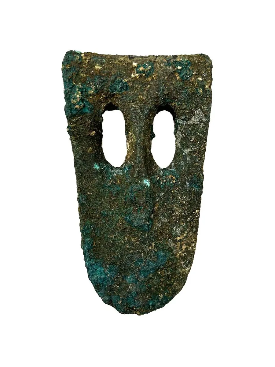 small metal axe head with two holes