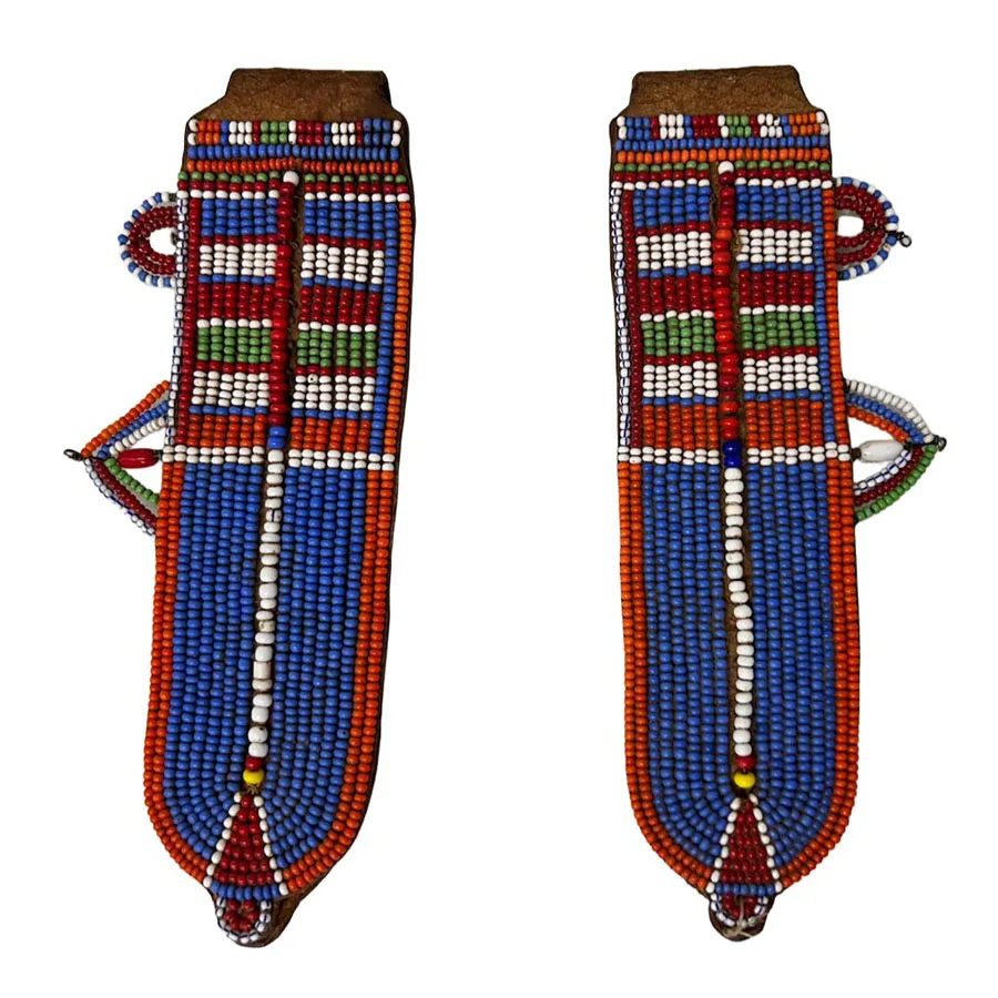 two pieces of heavily beaded leather
