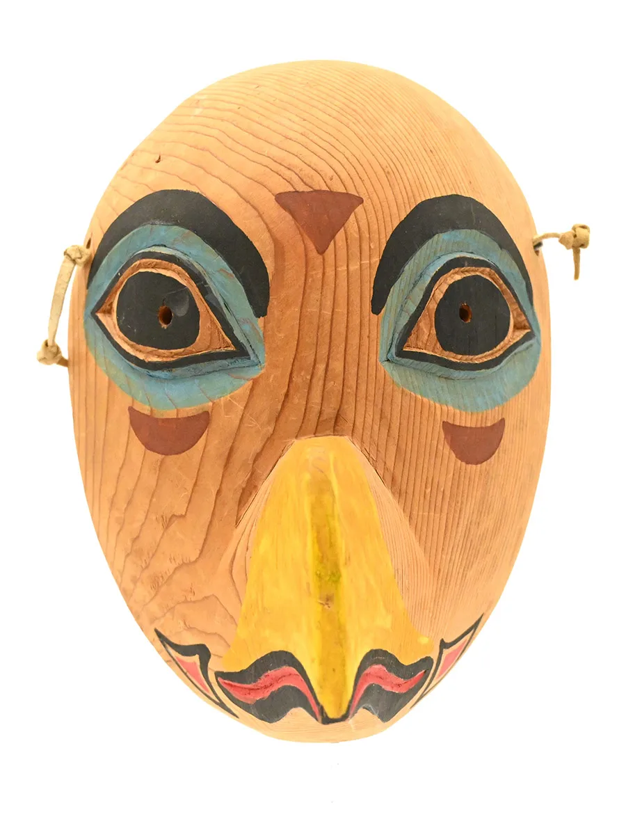 wooden mask in the shape of an eagle's face
