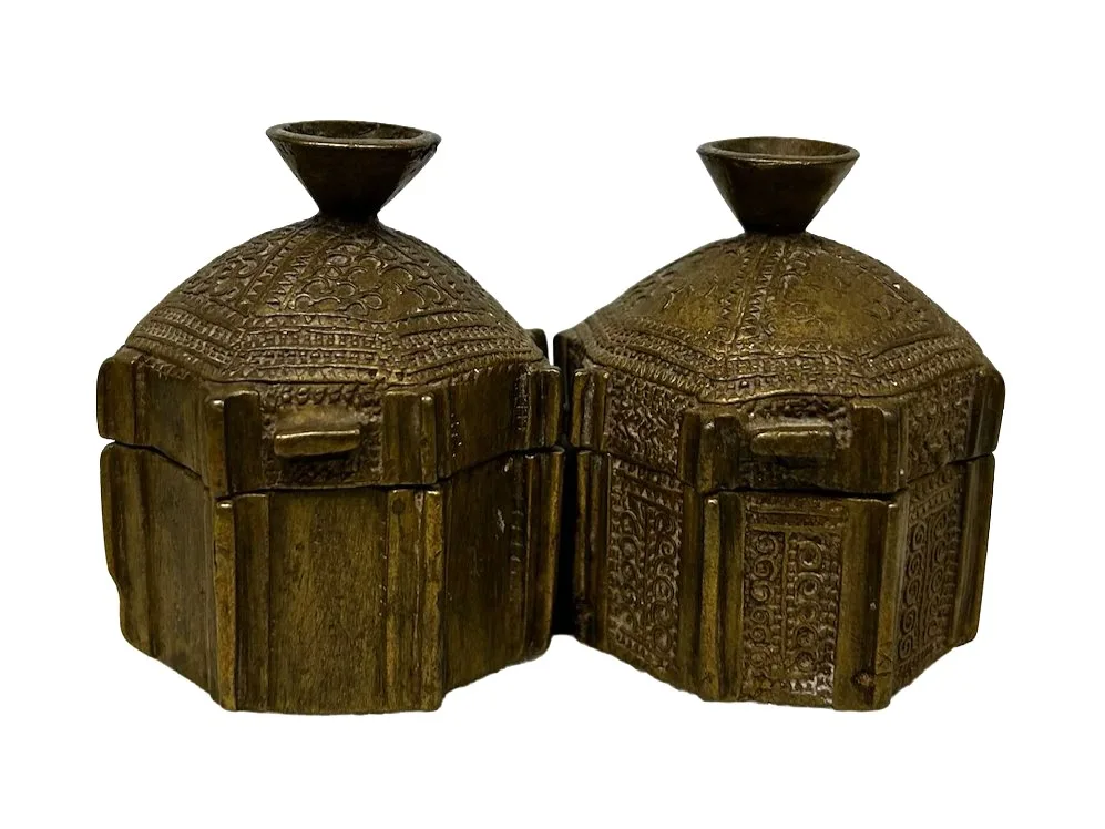 two brass inkwells connected side by side