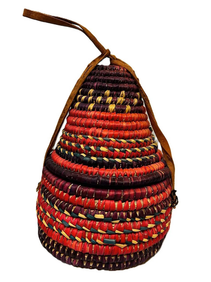small brightly colored basket with pointed lid