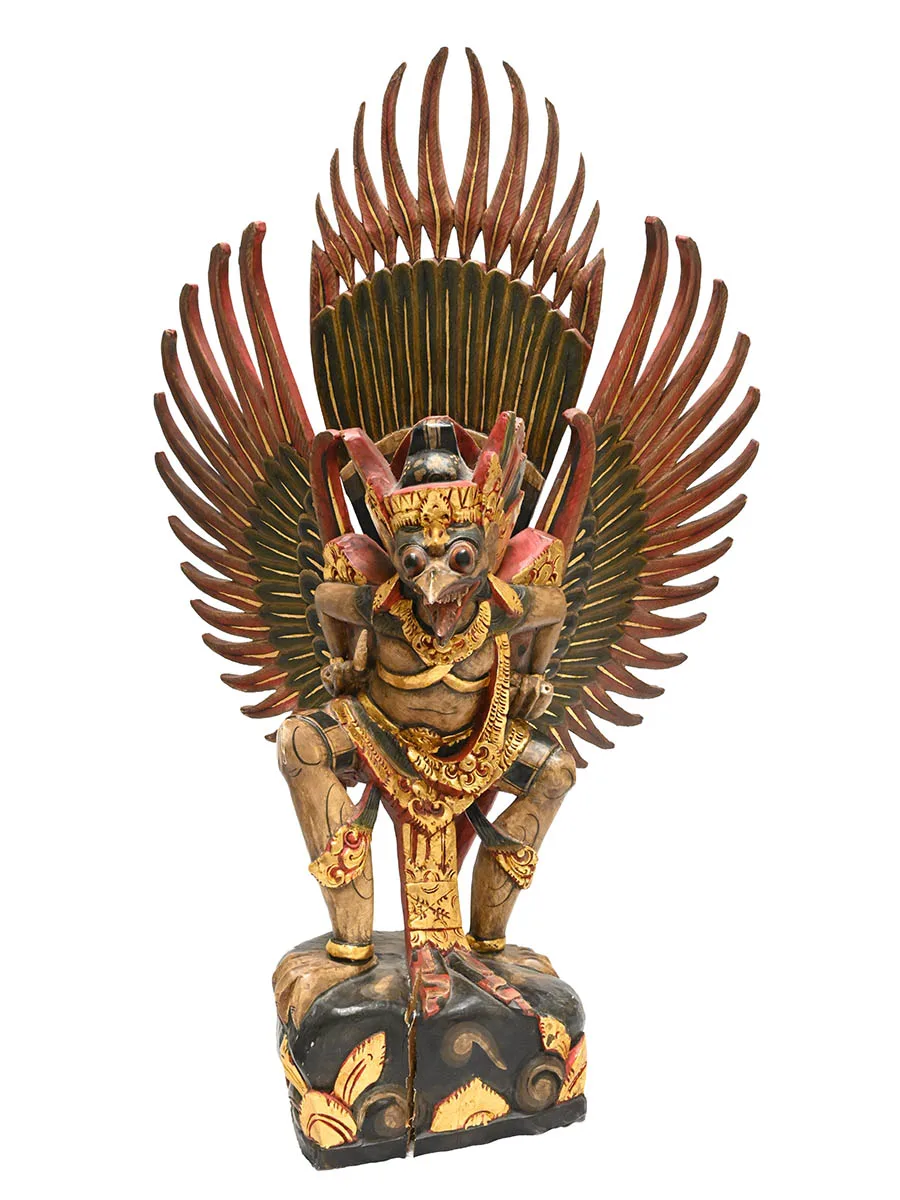 Wooden statue of bird-like creature