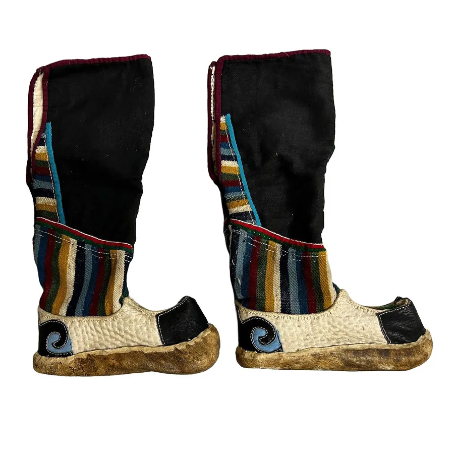 tall leather boots with colored stripes and upturned toes