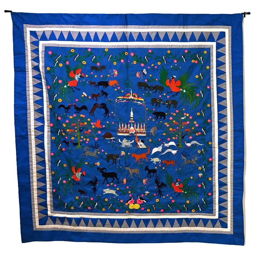 Embroidered quilt with blue background