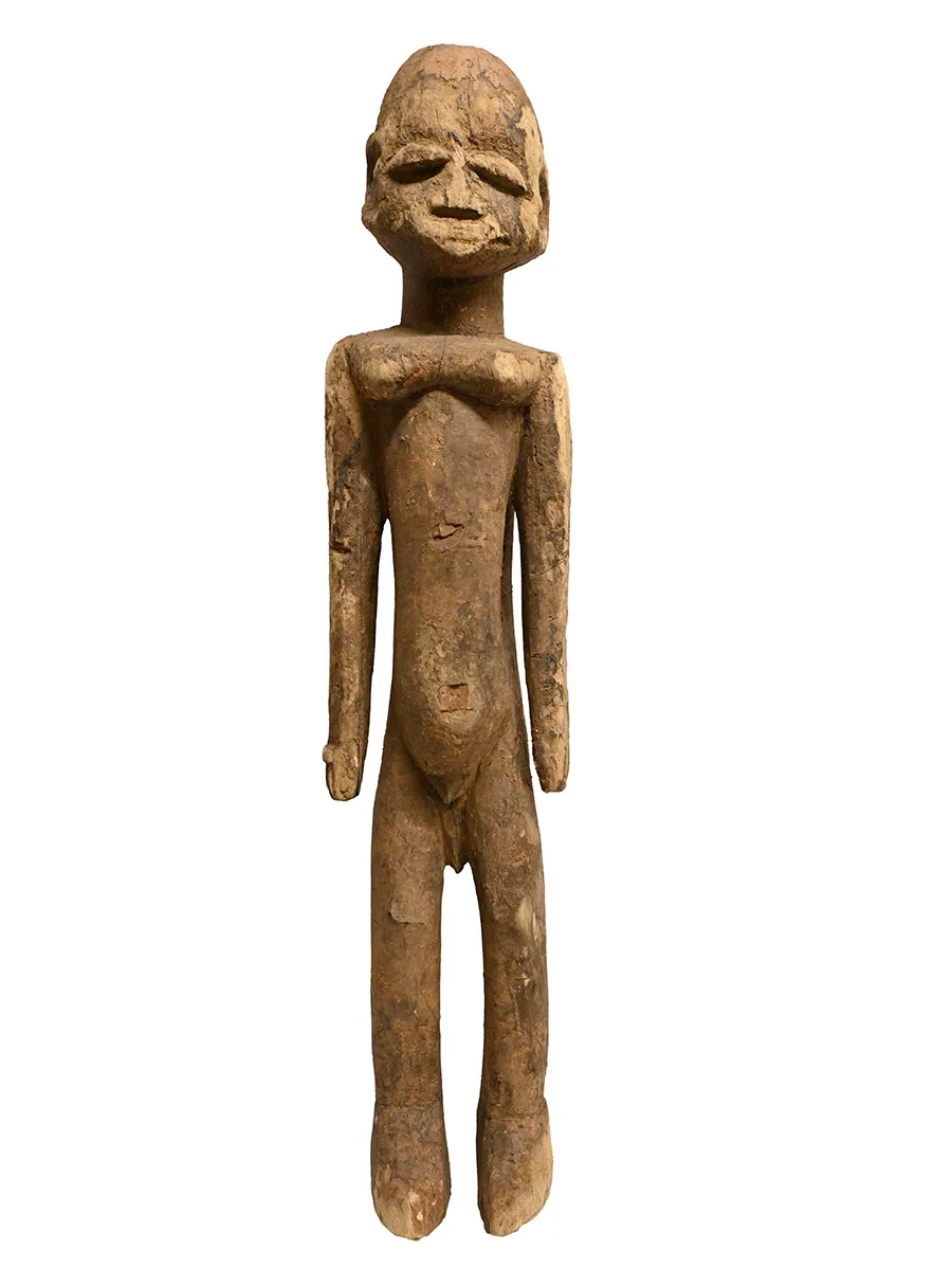 wooden carving of an elongated human figure