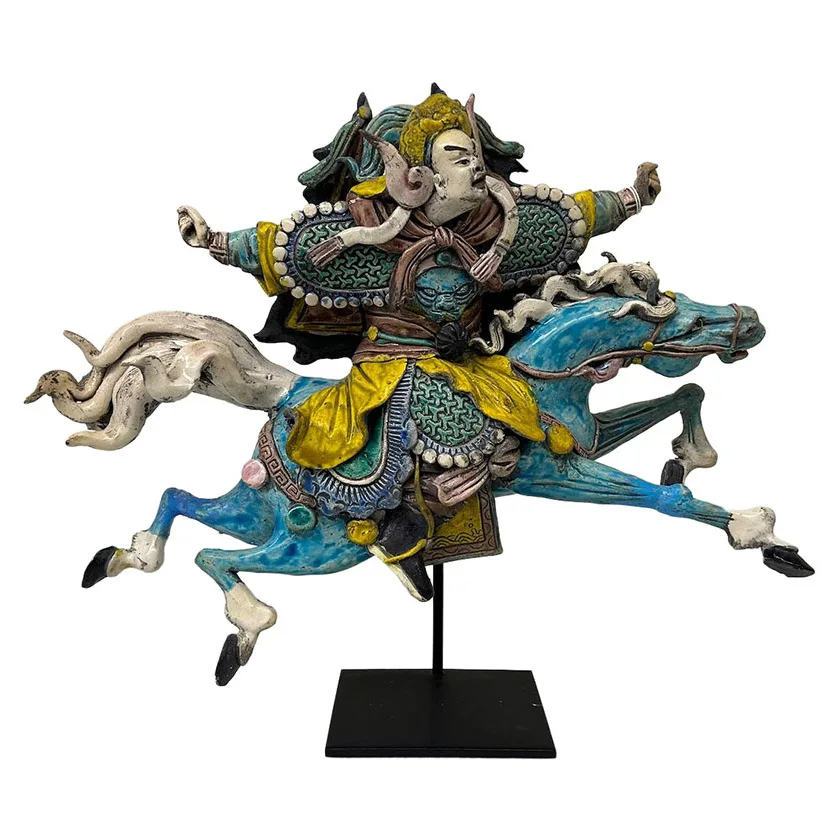 Ceramic figure of Chinese warrior riding a horse