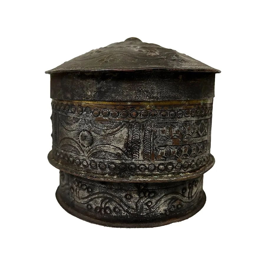 cylindrical metal container with lid, decorated with embossed designs