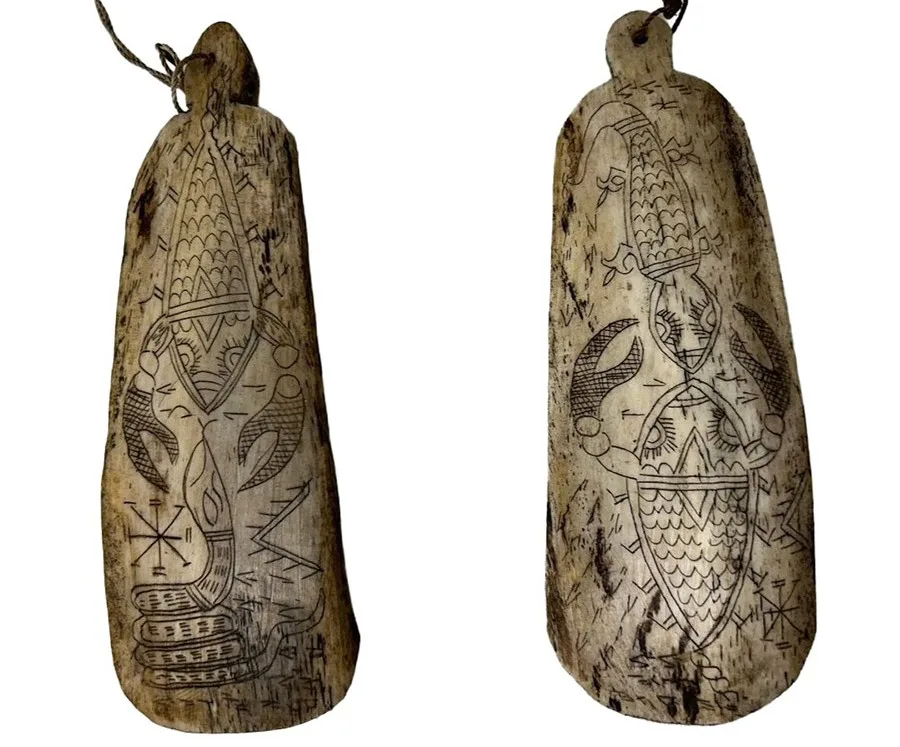 front side of animal bone pieces carved with designs