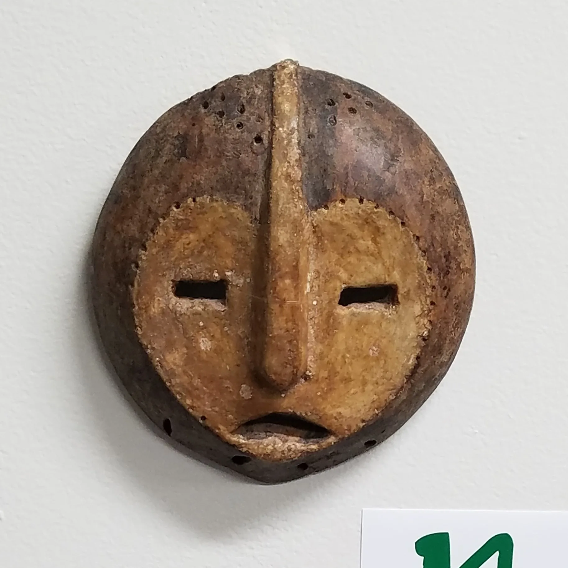 circular wooden mask