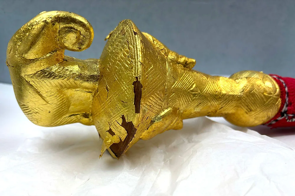Fly whisk handle with damage to gold leaf