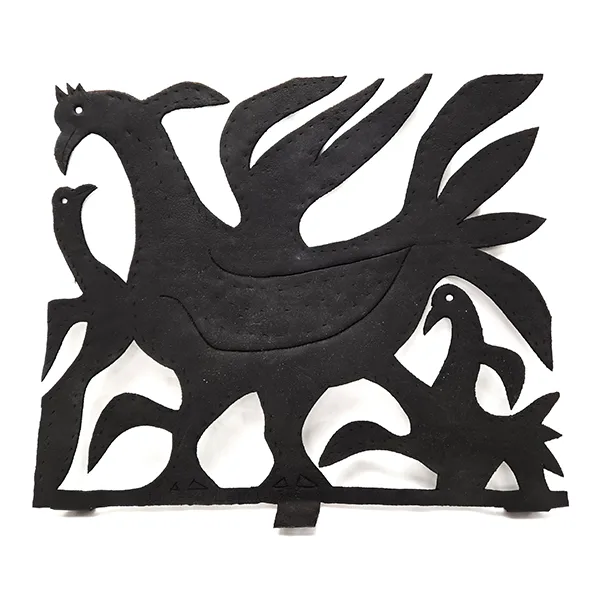 black cut metal depicting one large and two small chickens