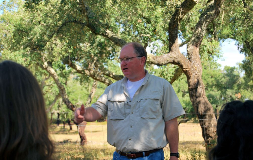 Dr. Paul Thacker instructing students at an excavation site