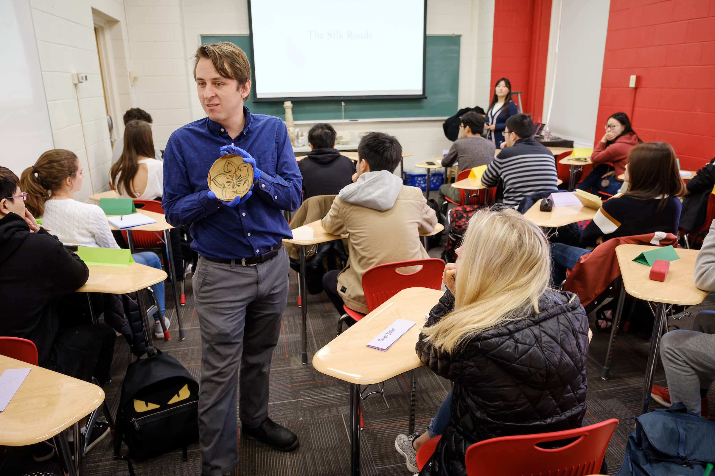 Andrew Gurstelle, director of the Wake Forest Lam Museum of Anthropology, talks about artifacts from the Tong Dynasty in history professor Dan Du's Chinese History class. The artifacts were donated by a Wake Forest alumnus.