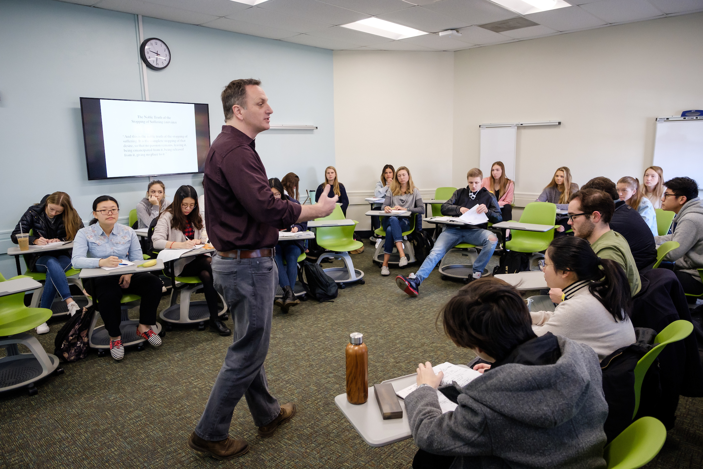 Wake Forest religion professor Jarrod Whittaker teaches the concept of Nirvana in Buddhist teaching, in the newly renovated Wingate 314 classroom space on Wednesday, March 20, 2019.