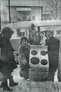 Beth Pirkle and Mike Bridges move a stove into their new home on Patterson Avenue in 1966.