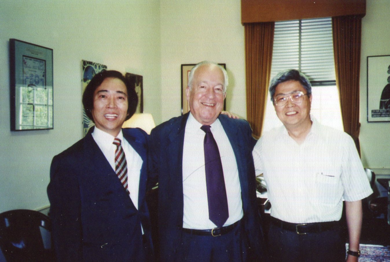 'We worship him,' say Augi (left) and Yuki (right), shown here with Dr. Wilson when he was provost.
