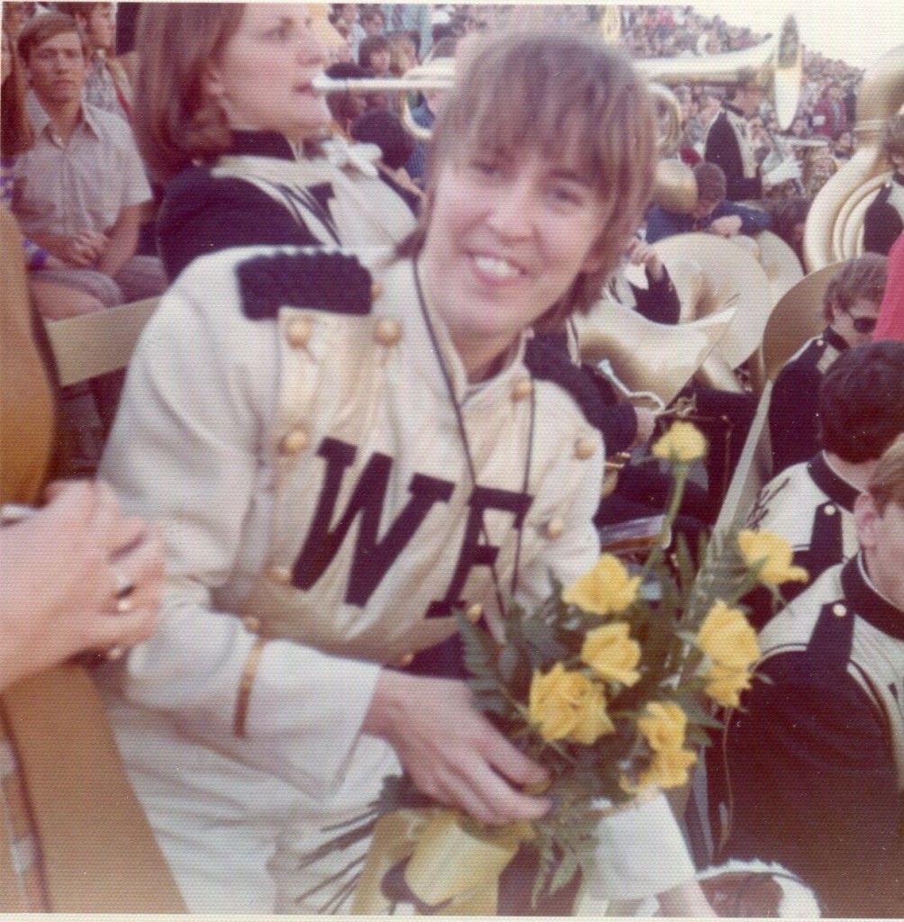 President Scales presented yellow roses to Pam Key at her last game as drum major.