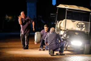 fleet workers Mark Shouse, Bruce Avelar and Mark Beckerdite turn the art of changing tires on a golf cart into a comedy routine
