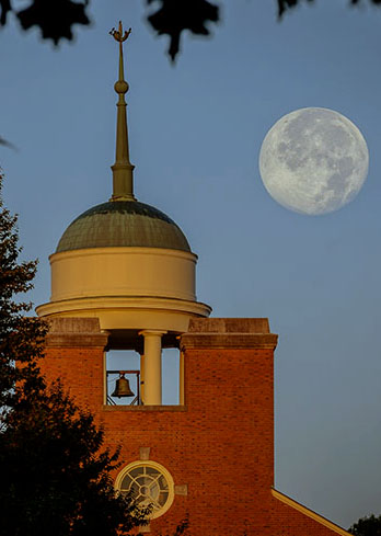 The moon sets over the Z. Smith Reynolds Library