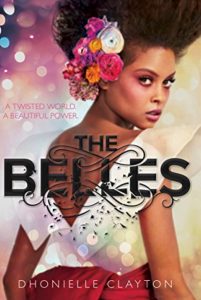 Cover of "The Belles" novel by Dhonielle Clayton ('05), beautiful Black Woman with flowers in her hair looking over her shoulder
