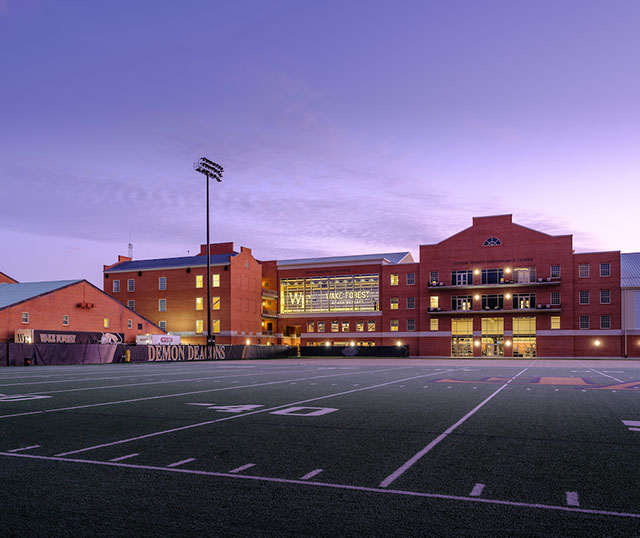 The Wake Forest athletics complex as seen from the football practice field before sunrise on Tuesday, January 19, 2021. The Miller Center, Shah Basketball Complex, Sutton Sports Performance Center, and McCreary Field House.