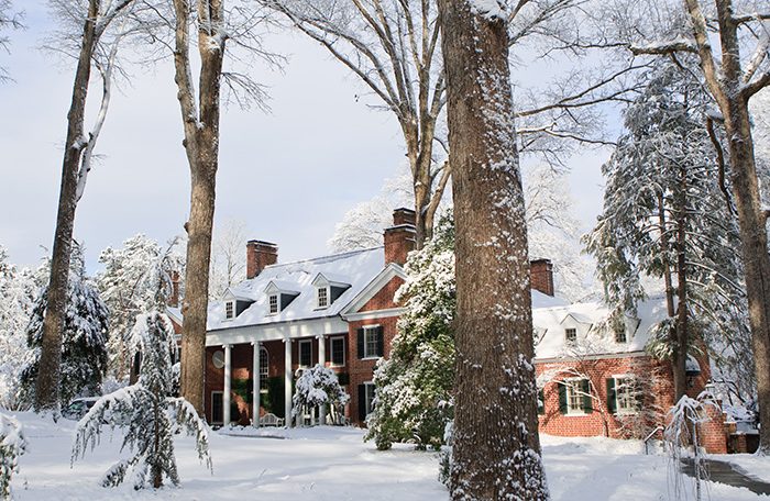 Snow blankets the grounds at the Wake Forest University President's House 