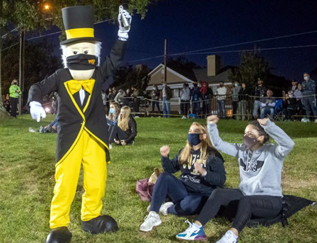 Fans cheer on the WFU soccer teams from "The Hill" overlooking Spry Stadium along Polo Road.