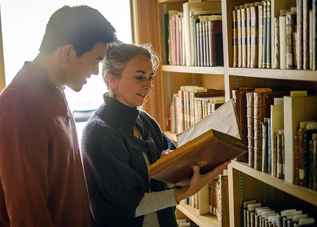 Wake Forest English professor Jessica Richard talks with senior English major Kevin Wang ('17) in the special collections are of the Z. Smith Reynolds Library