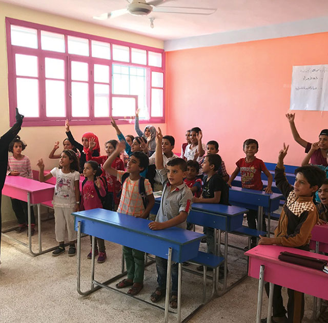 Students in class at a refurbished school in Raqqa, Syria, in 2018. (Photo courtesy of Roebuck)