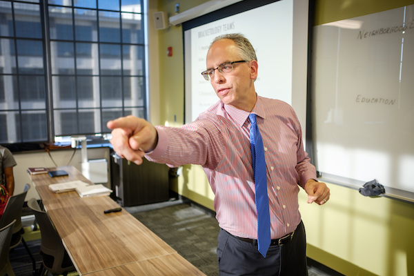 Rogan Kersh points during teaching at Wake Downtown.