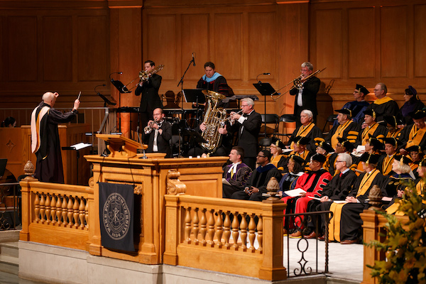 The Brass Ensemble and organ perform on the stage of Wait Chapel during inauguration.