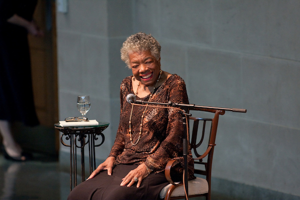Photo of Maya Angelou in chair in Wait Chapel smiling