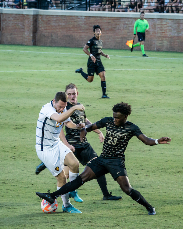 Wake Forest soccer players compete against West Virginia in Spry Stadium.