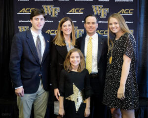 A photo of John Currie with his wife, Mary Lawrence, and their children, Jack, GiGi, and Mary-Dell.