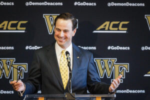 John Currie smiles at his introductory news conference