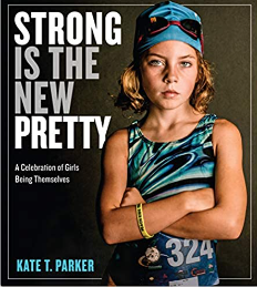 The cover photo of her daughter in a swimsuit with arms crossed and looking fierce on the cover of "Strong is the New Pretty."