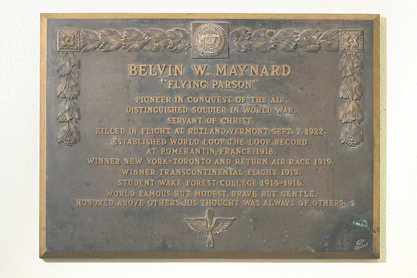 Plaque that reads "BELVIN W. MAYNARD 'THE FLYING PARSON'"