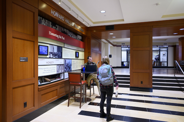 Students walking by the Howard Hall of Traditions