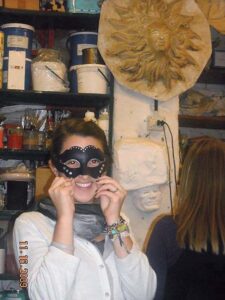 A student wears a black mask on her eyes