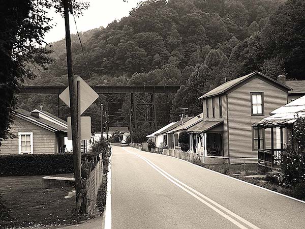 The two-lane road that goes through Slab Fork, West Virginia, with buildings lined just inches from the road.
