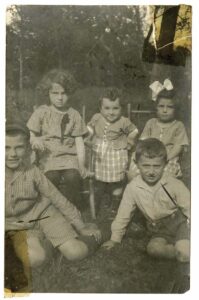 black and white photo of five young children