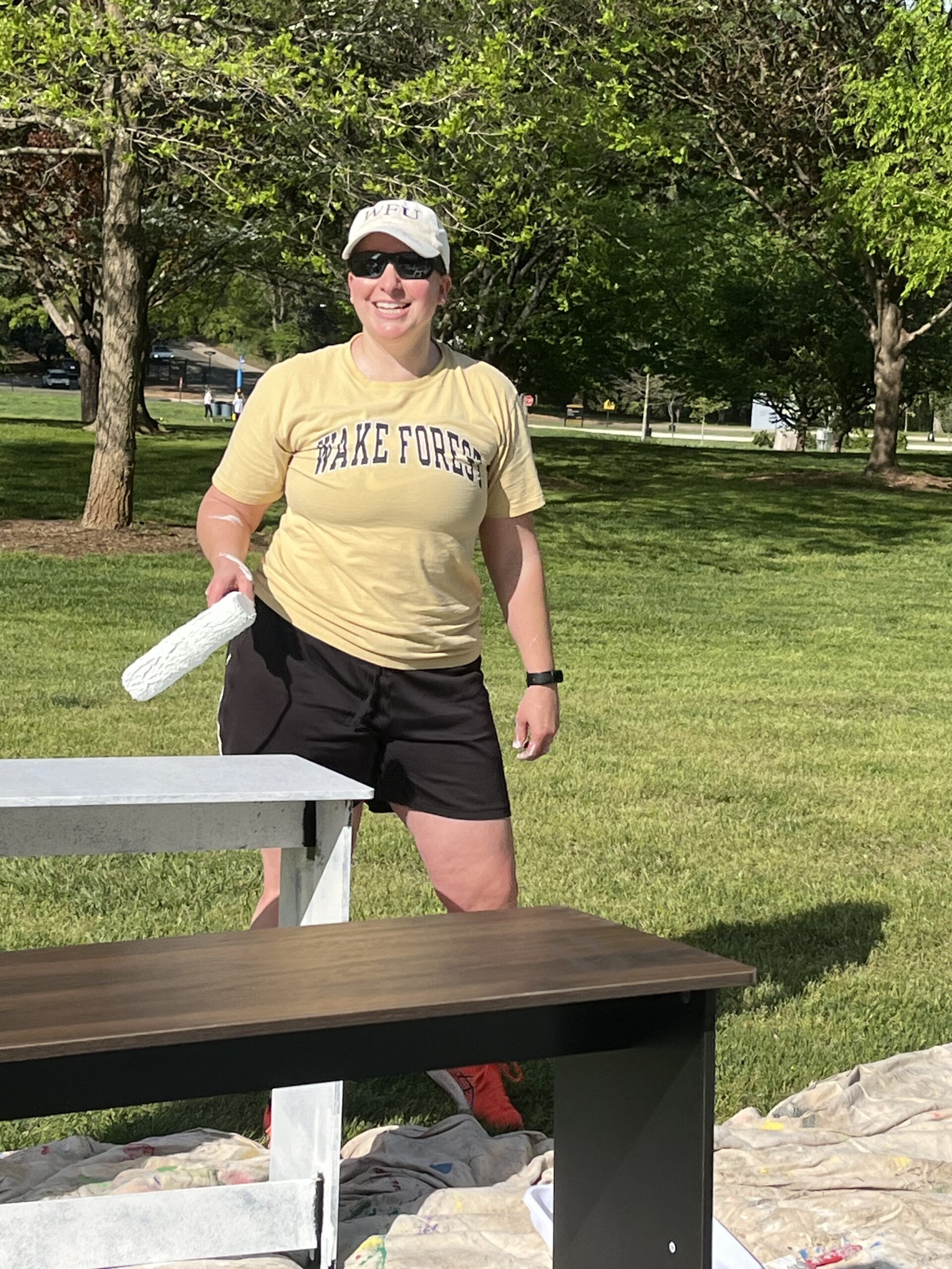 Kristen (Franke) Johnson ('00), a middle school teacher, hard at work priming desks.