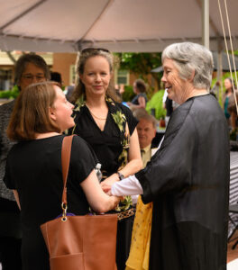 Hundreds of people attend a Memorial Service for Edwin G. Wilson at Wait Chapel on Friday, May 3, 2024. Memorial attendees enjoy a barbecue picnic on Hearn Plaza following the memorial and take time to visit with Emily Wilson and other members of the Wilson families.