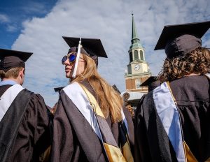 Students at commencement ceremony with Wait Chapel in the backdrop. 2016